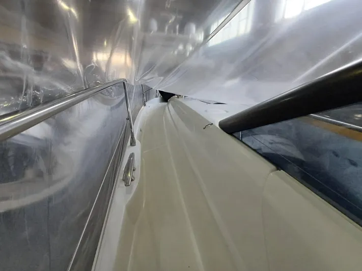  Yacht Photos Pics 2020 Prestige 590 yacht under protective cover in a storage facility.