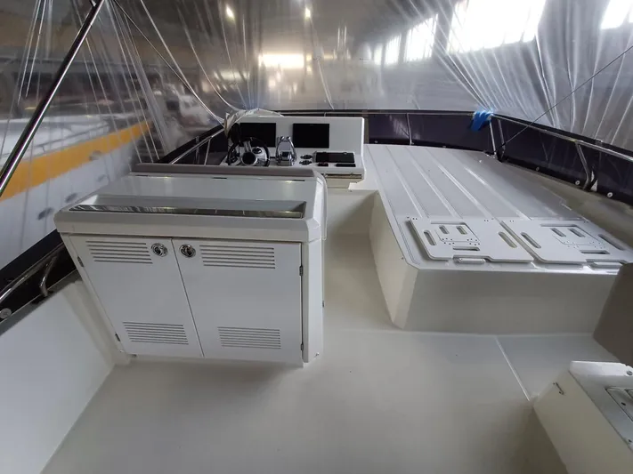  Yacht Photos Pics 2020 Prestige 590 yacht interior with modern helm and seating area.