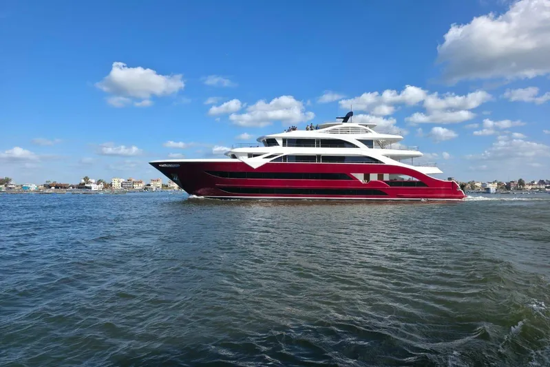 M/y Oxygen Yacht Photos Pics Luxurious 2025 47m Expedition Yacht cruising on a sunny day, with clear blue skies.