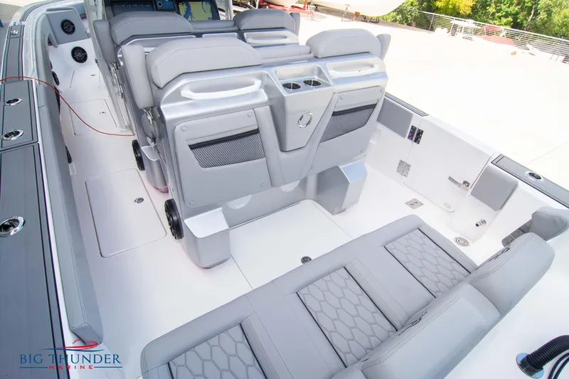  Yacht Photos Pics 2023 Fountain 38 SC boat interior with gray seating and modern design.