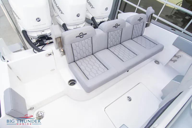  Yacht Photos Pics 2023 Fountain 38 SC boat with gray seating and triple outboard engines.