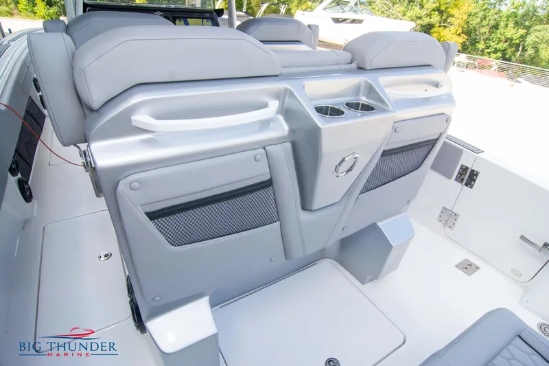  Yacht Photos Pics 2023 Fountain 38 SC boat interior with gray seating and cup holders.