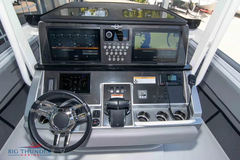  Yacht Photos Pics 2023 Fountain 38 SC boat dashboard with advanced navigation and control systems.