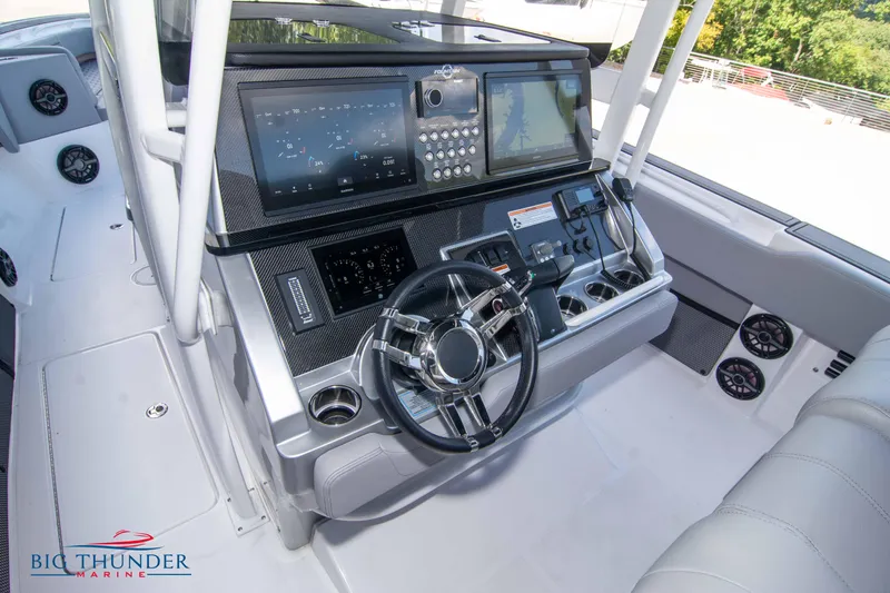  Yacht Photos Pics 2023 Fountain 38 SC boat dashboard with advanced navigation and control systems.