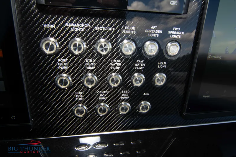  Yacht Photos Pics Control panel of a 2023 Fountain 38 SC boat with various switches.