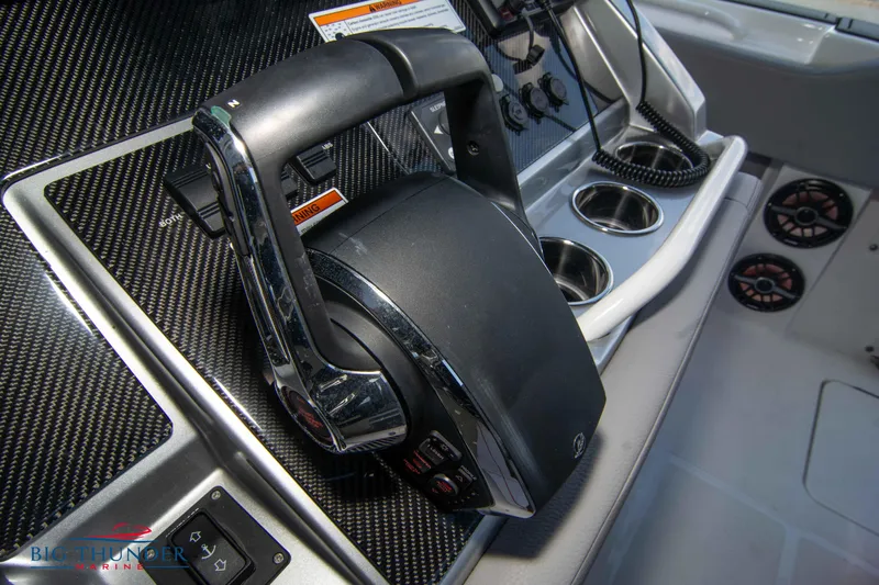  Yacht Photos Pics 2023 Fountain 38 SC boat helm with carbon fiber dashboard and modern controls.