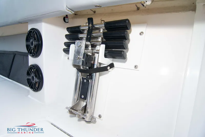  Yacht Photos Pics 2023 Fountain 38 SC boat interior with mounted rod holders and speakers.