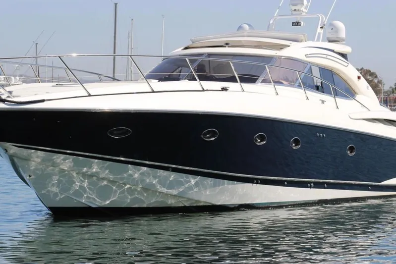 D Yacht Photos Pics Luxury Sunseeker Predator 60 yacht from 2000 on calm water.