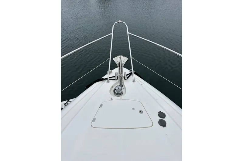 D Yacht Photos Pics Bow view of 2000 Sunseeker Predator 60 yacht on calm water.