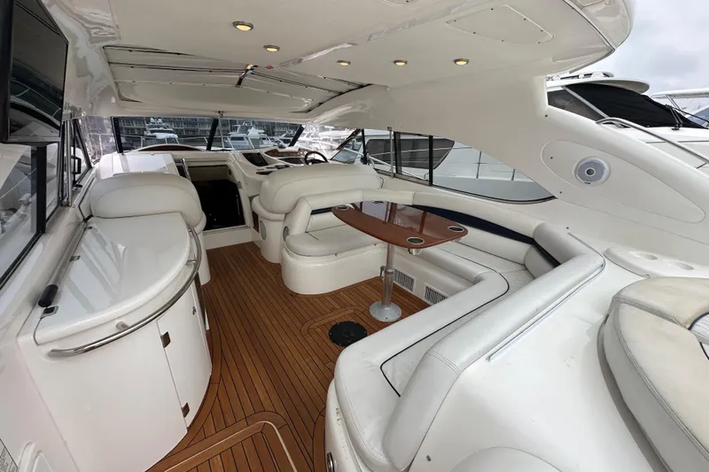 D Yacht Photos Pics Luxurious interior of 2000 Sunseeker Predator 60 yacht with elegant seating and wooden flooring.