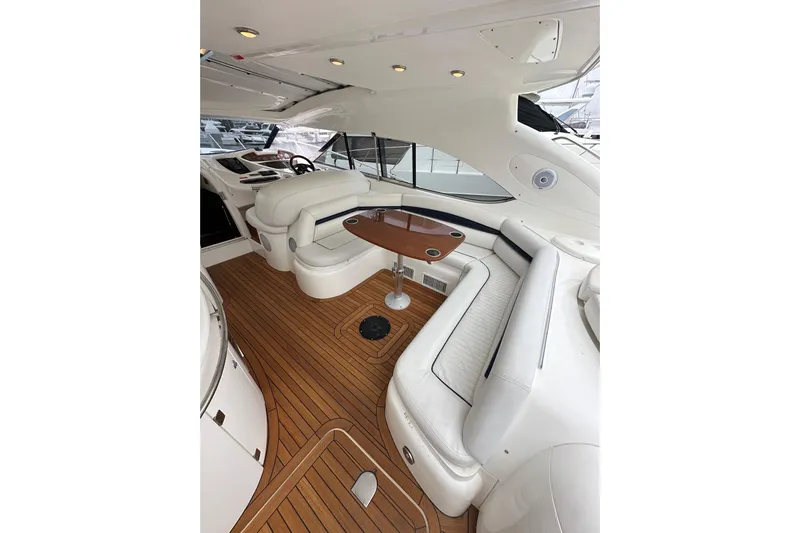 D Yacht Photos Pics Luxurious interior of a 2000 Sunseeker Predator 60 yacht with elegant seating and wooden flooring.