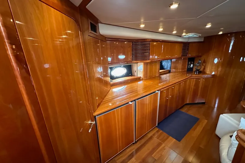 D Yacht Photos Pics Luxurious wooden interior of 2000 Sunseeker Predator 60 yacht, featuring sleek cabinetry and ambient lighting.