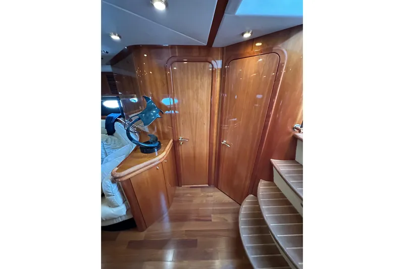 D Yacht Photos Pics Luxurious interior of 2000 Sunseeker Predator 60 yacht with polished wood finishes.