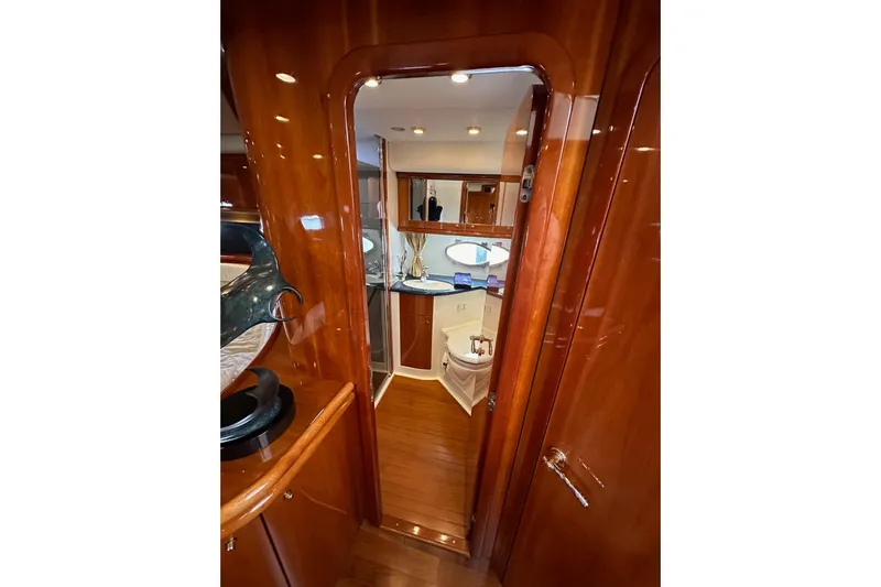 D Yacht Photos Pics Luxurious interior of 2000 Sunseeker Predator 60 yacht with polished wood finish.