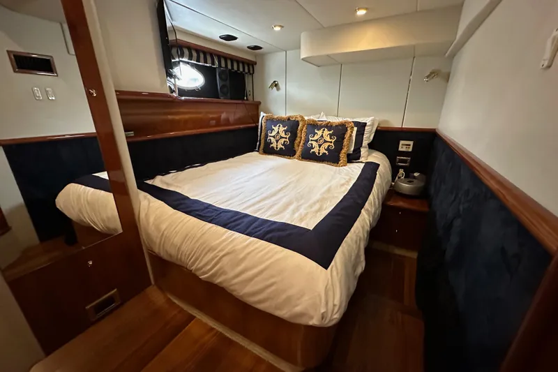 D Yacht Photos Pics Luxurious bedroom interior of 2000 Sunseeker Predator 60 yacht with elegant bedding.