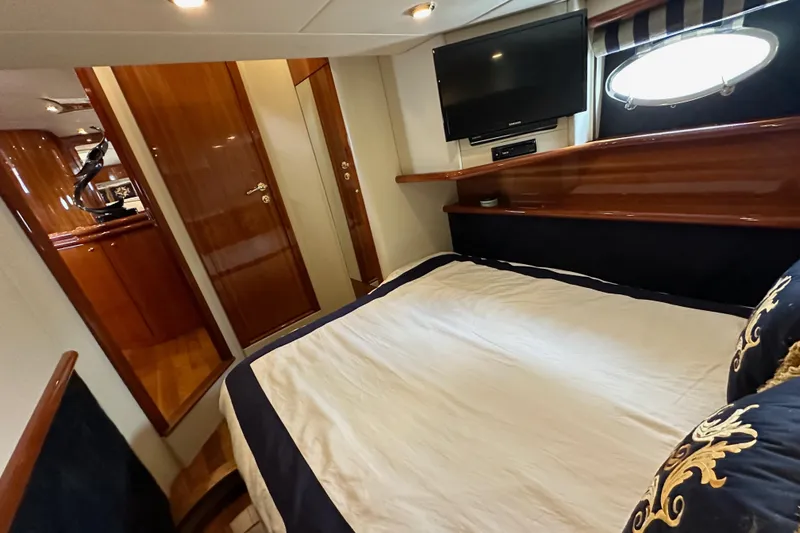 D Yacht Photos Pics Luxurious cabin interior of 2000 Sunseeker Predator 60 yacht with elegant wood finishes.