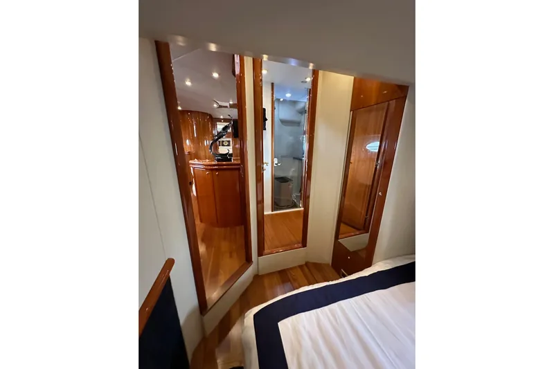 D Yacht Photos Pics Interior of 2000 Sunseeker Predator 60 yacht with polished wood finishes and modern design.
