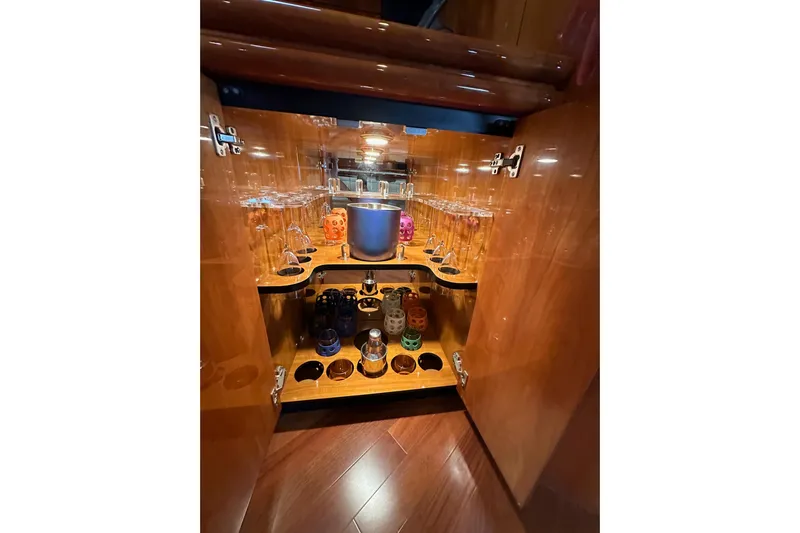 D Yacht Photos Pics Luxurious wooden cabinet with glassware and accessories on Sunseeker Predator 60 yacht, 2000 model.