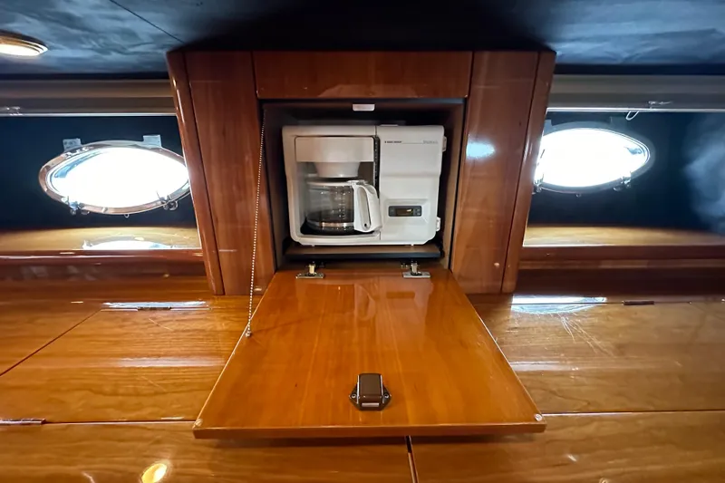 D Yacht Photos Pics Coffee maker in wooden cabinet aboard 2000 Sunseeker Predator 60 yacht.