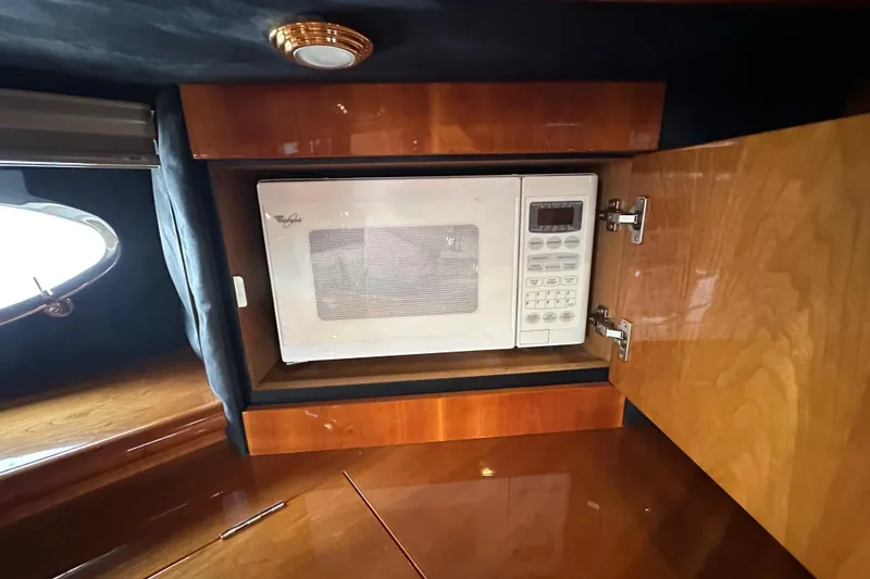 D Yacht Photos Pics Microwave inside Sunseeker Predator 60 yacht's wooden cabinet, 2000 model.