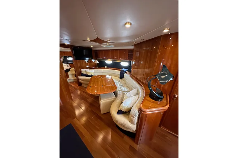 D Yacht Photos Pics Luxurious interior of 2000 Sunseeker Predator 60 yacht with elegant wood finishes.