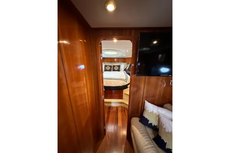 D Yacht Photos Pics Luxurious cabin interior of 2000 Sunseeker Predator 60 yacht with wood paneling.