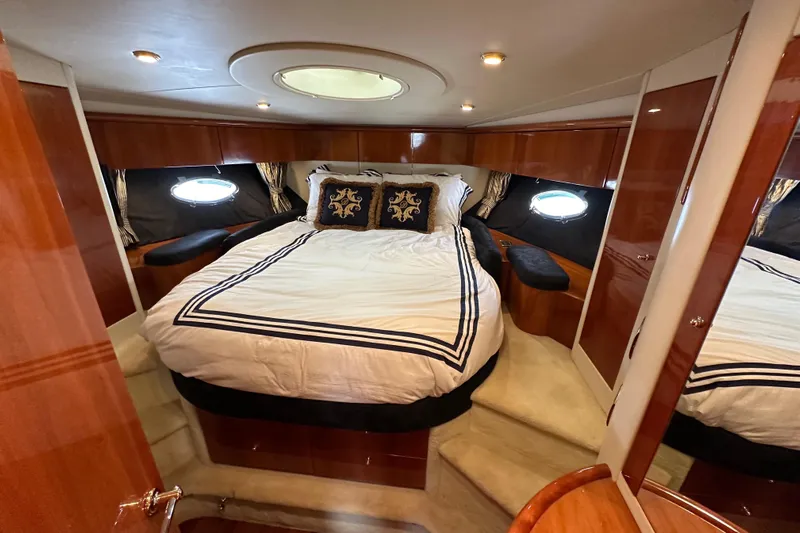 D Yacht Photos Pics Luxurious bedroom interior of 2000 Sunseeker Predator 60 yacht with elegant bedding.