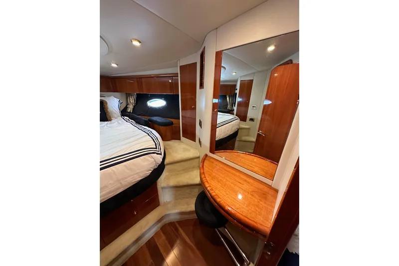 D Yacht Photos Pics Luxurious cabin interior of 2000 Sunseeker Predator 60 yacht with elegant wood finishes.