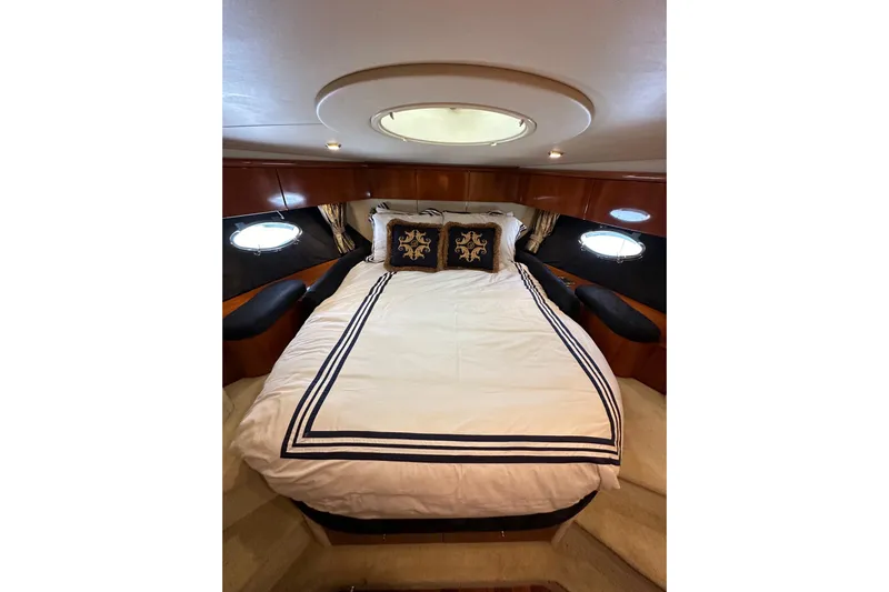 D Yacht Photos Pics Luxurious bedroom interior of 2000 Sunseeker Predator 60 yacht with elegant bedding.