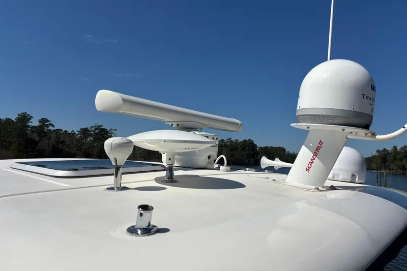Salina Yacht Photos Pics Radar and satellite equipment on a 2004 Tiara Yachts 3600 Sovran under clear blue sky.