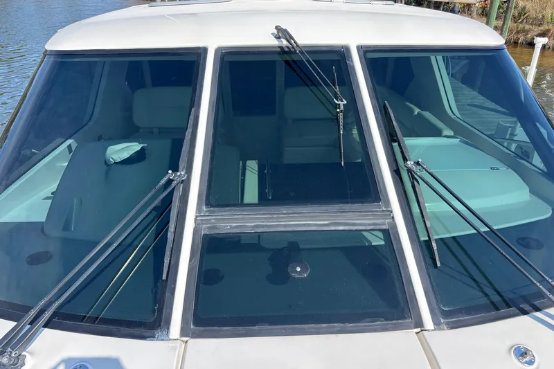 Salina Yacht Photos Pics 2004 Tiara Yachts 3600 Sovran windshield with wipers, docked on calm water.