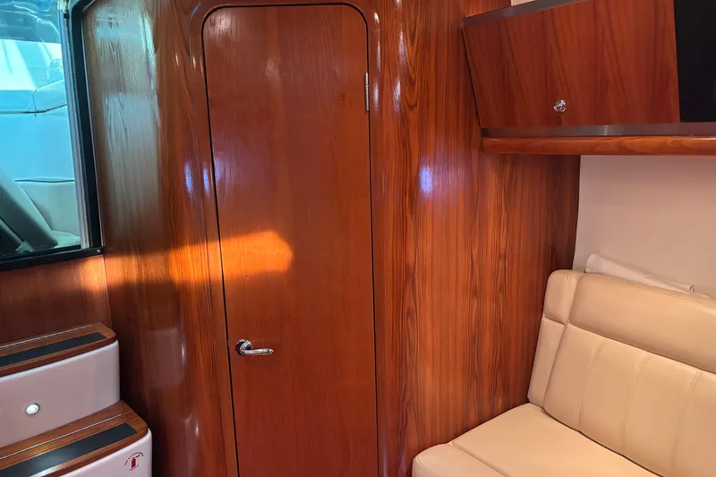 Salina Yacht Photos Pics 2004 Tiara Yachts 3600 Sovran interior with wood paneling and beige seating.