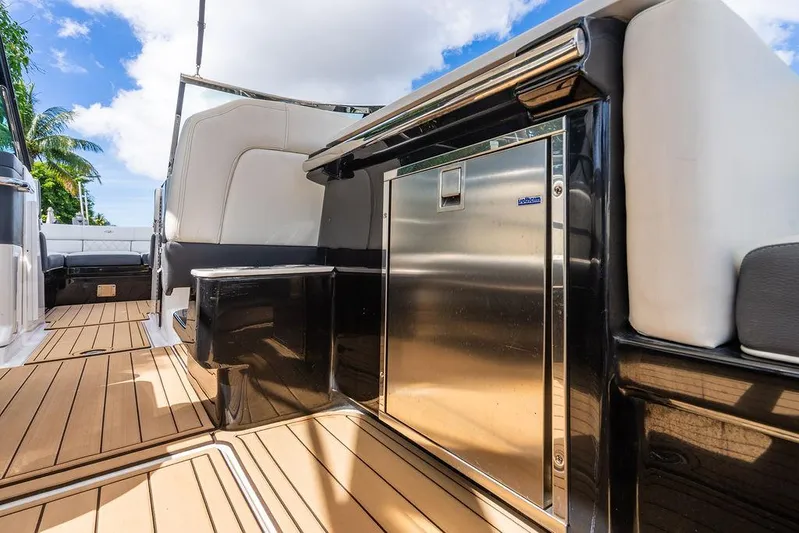 Dreamaker Yacht Photos Pics 2021 Regal 29 OBX boat interior with sleek seating and wooden flooring.