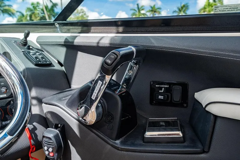 Dreamaker Yacht Photos Pics 2021 Regal 29 OBX boat dashboard with steering wheel and control panel.