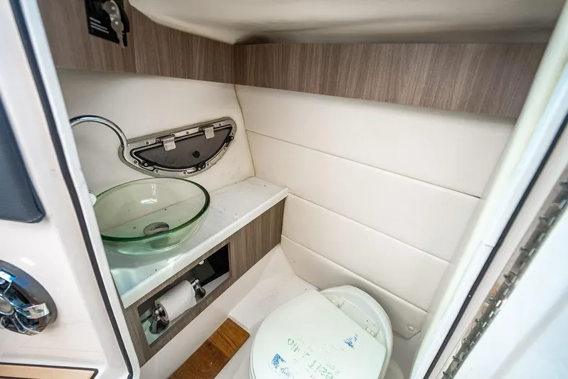 Dreamaker Yacht Photos Pics 2021 Regal 29 OBX boat bathroom with glass sink and modern design.