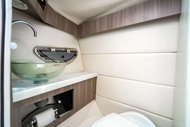 Dreamaker Yacht Photos Pics 2021 Regal 29 OBX boat interior bathroom with modern sink and compact design.