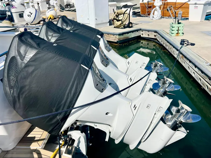 Risk & Reward Yacht Photos Pics 2022 Back Cove 39O outboard engines at marina dock, covered and secured.