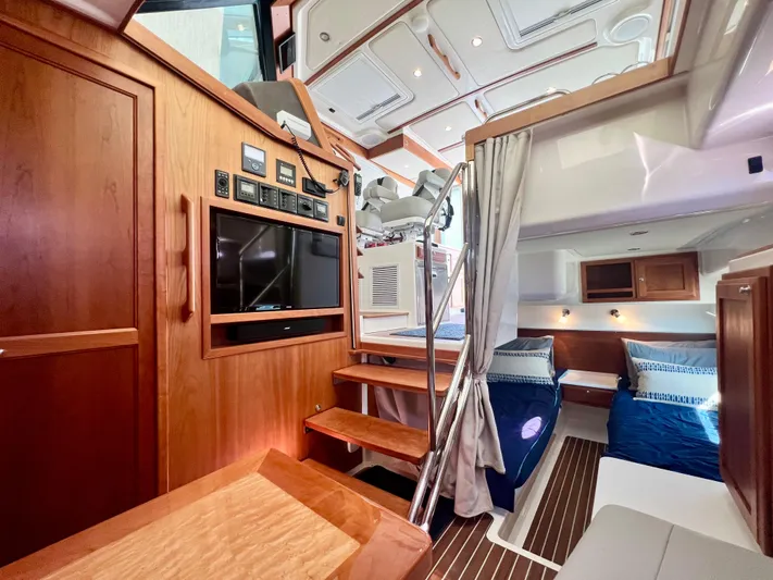 Risk & Reward Yacht Photos Pics Luxurious interior of 2022 Back Cove 39O yacht with wood finishes and modern amenities.