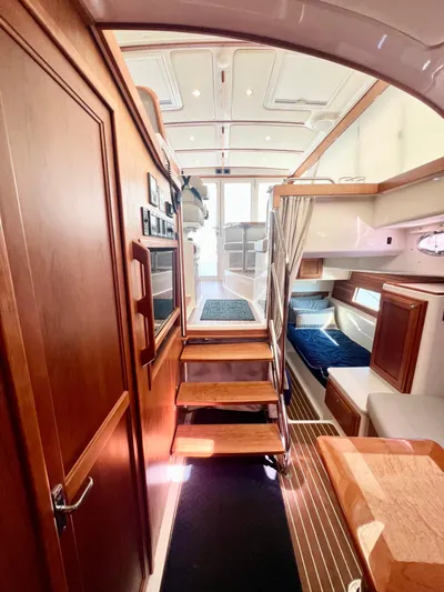 Risk & Reward Yacht Photos Pics Interior of 2022 Back Cove 39O yacht, featuring wooden cabinetry and modern design.