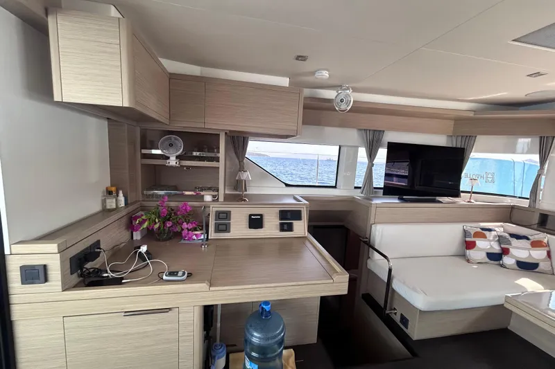 Nani Yacht Photos Pics Modern interior of 2024 Lagoon 55 yacht with sleek design and ocean view.