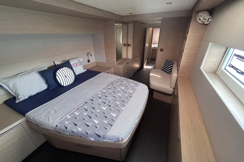 Nani Yacht Photos Pics Luxurious 2024 Lagoon 55 yacht bedroom with modern design and comfortable bedding.
