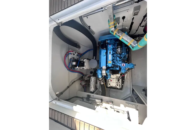 Nani Yacht Photos Pics Engine compartment of 2024 Lagoon 55 yacht, showcasing a blue marine engine.