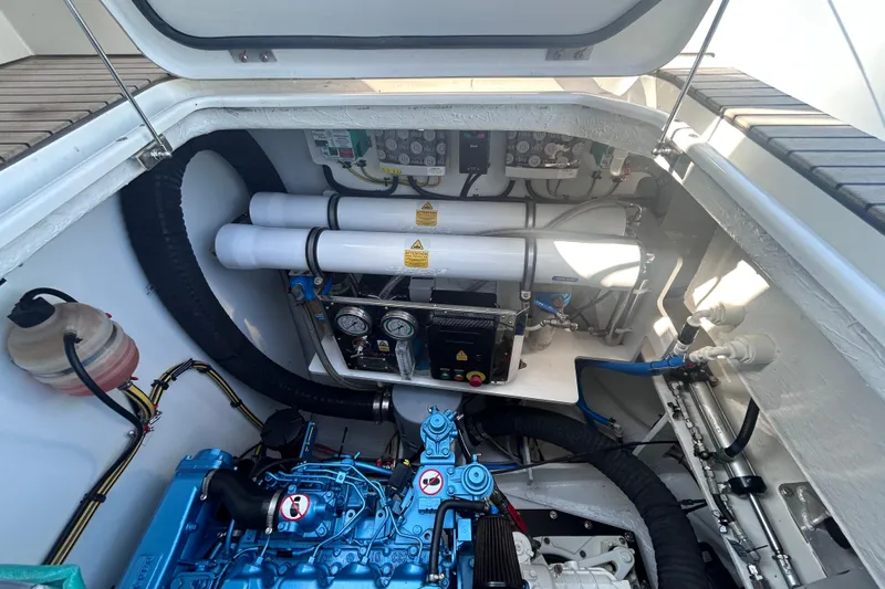 Nani Yacht Photos Pics Engine compartment of 2024 Lagoon 55 yacht, showcasing mechanical components and systems.