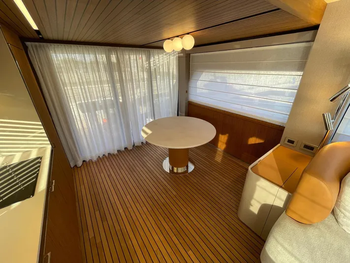  Yacht Photos Pics Luxurious interior of 2025 Cranchi 62 Sessantadue yacht with modern decor and wooden flooring.