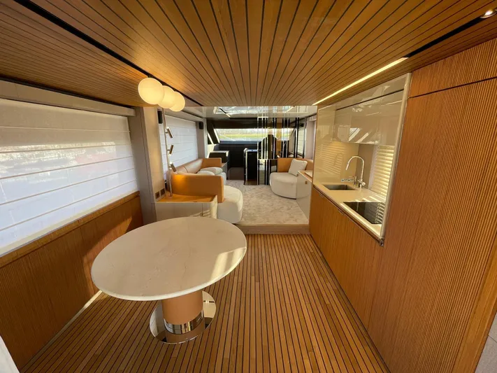  Yacht Photos Pics Luxurious interior of 2025 Cranchi 62 Sessantadue yacht with modern design and wood accents.