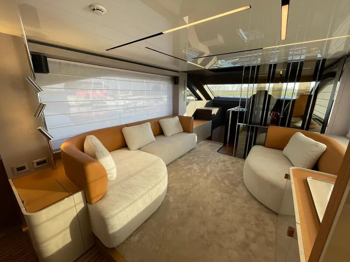  Yacht Photos Pics Luxurious interior of 2025 Cranchi 62 Sessantadue yacht with modern seating and elegant design.