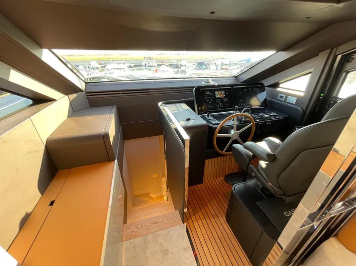  Yacht Photos Pics Luxurious helm of 2025 Cranchi 62 Sessantadue yacht with modern controls and seating.