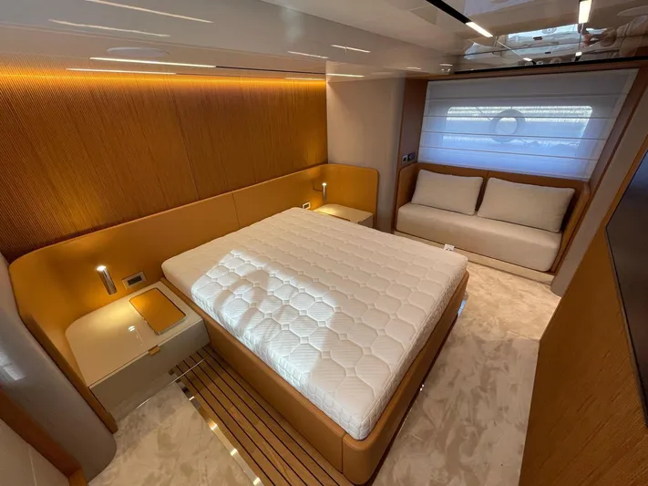  Yacht Photos Pics Luxurious bedroom interior of 2025 Cranchi 62 Sessantadue yacht with modern design.
