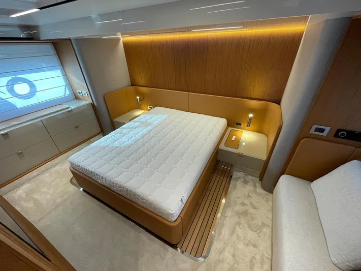  Yacht Photos Pics Luxurious bedroom interior of 2025 Cranchi 62 Sessantadue yacht with modern design elements.