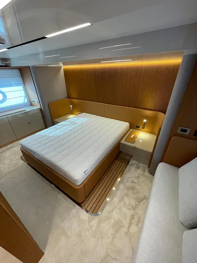  Yacht Photos Pics Luxurious bedroom interior of 2025 Cranchi 62 Sessantadue yacht with modern design.